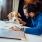 Man working from home while petting his dog